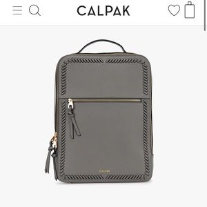 Grey Calpak backpack. Great for travel! Space for your laptop and super cute.